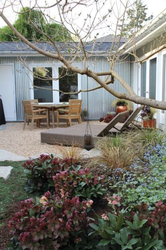 The shady side of the house doesn’t have to be drab. In this low-light planting, Tish mixes Helleborus ‘Pink Frost’ and Brunnera macrophylla ‘Jack Frost.’