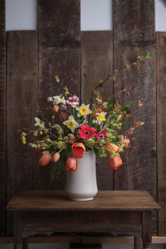 A BUTTERCUP WINTERHAZEL & FLOWERING CURRANT BOUQUET – THE STEMS YOU’LL NEED: 8 Tulipa ‘Apricot Impression,’ 3 Edgeworthia chrysantha ‘Akebono,’ 2 Rhododendron lutescens, 2 Illicium anisatum, 3 Helleborus argutifolius, 3 Anemone coronaria, 1 Ribes sanguineum, 3 Corylopsis pauciflora, 3 Spirea japonica ‘Goldflame’ foliage, 6 Narcissus ‘Silver Standard.’