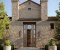 Four inch cobblestones from Ibison Stone of Oklahoma, which match the stone used in the home’s original façade, were placed in a fish scale fan pattern the whole length of the 1/4 mile long driveway. A large fountain was replaced with an exterior “tile carpet” that defines the entry. Sevigny built a temporary mezzanine to help finish carpenters and mason John Taylor, who installed the heavy stone fireplace blocks from China. Some of the stones were cut from water troughs in which well-worn rope holes used to tether animals are still visible.