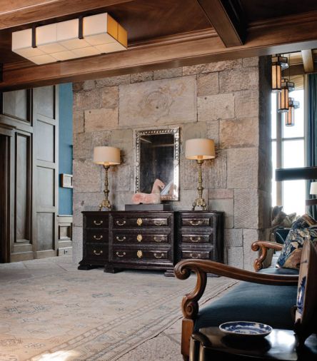A Flemish antique bench from Obsolete in Santa Monica; entry credenza from Therien & Co. in Los Angeles.