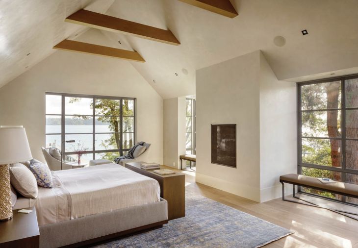 The soaring gable roof is finished with a white oak support beam that is also structural to the roof. Baker works with local manufacturers for such custom pieces as the master night stands, bed and chest at the foot of the bed containing the television. “That way,” she says, “we’re getting the highest quality American made furniture product at a relatively competitive price, with one person working on it from start to finish.”