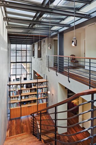 Osolin loved working with Tod Von Mertens on the staircase fabrication. “He was quite an amazing craftsman to work with. We got to work with so many elemental materials – steel, glass, concrete, bentwood – it’s really remarkable.” Illuminated from above by a large-scale skylight, the staircase is a focal point for the home.