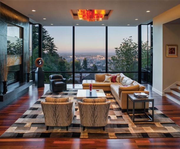 A trip to the Light in Art Gallery in Los Angeles yielded several hand-cast light fixtures, including this living room one from Israeli artist Shimal’e Peleg. Individual glass pieces had to be carefully constructed upon arrival. Miller recommended finishes: Montauk black slate and translucent onyx behind the TV. Fireplace from Fireside Distributors; Brazilian walnut flooring from Emerson Hardwood Floors; furnishings from Parker Furniture. Living room area rug is from Tufenkian Artisan Carpets.