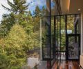Glass railings ring the terrace off master.