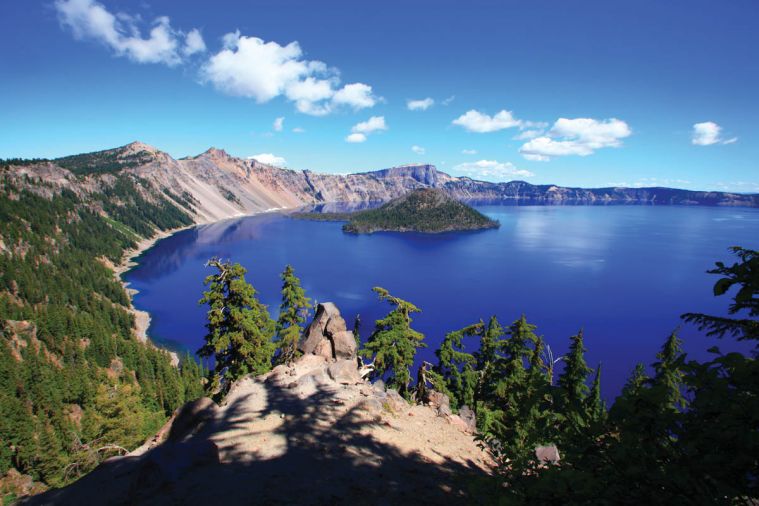 Crater Lake, high in the Cascade Mountains, is Oregon’s shimmering blue gem. It’s a must-see landmark during any trip to Southern Oregon.