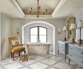 An indirectly lit period cove ceiling features Venetian plaster and reproduction chandelier - the latter is found replicated in the adjacent master bedroom’s vaulted ceiling. Carrara floor tile with ornate band designed by Hyde Evans. Antique upholstered chair found in San Francisco.