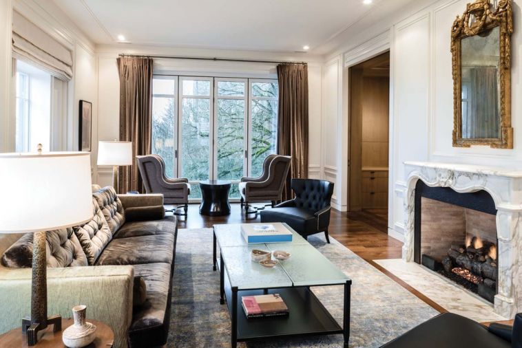 The living room features a custom hair on hide sofa frame with silk velvet cushions paired with Jean de Merry wing back “Laurent” chairs, and GCW lounge chairs in leather and fabric.