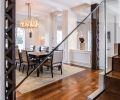 GCW hired Stephen Hirt to execute his design of the unique chandelier. His table and chairs with Holly Hunt leather juxtapose exposed steel girders.