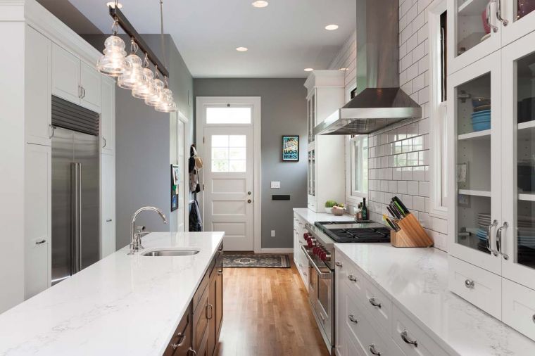 Countertops made of Statuario Polished Quartz from Pental Surfaces give a bright, airy feel to the kitchen. The Wilsons liked the look of marble, but as a family with two young children, they were turned off by marble’s relatively high maintenance. This quartz resembles marble, but is much more durable.