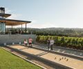 Visitors combining wine tasting with bocci ball at Ponzi Vineyards in the Willamette Valley.