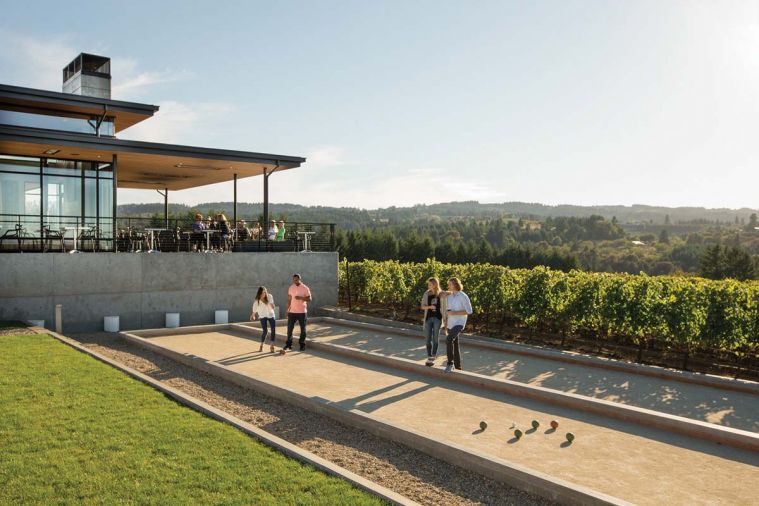 Visitors combining wine tasting with bocci ball at Ponzi Vineyards in the Willamette Valley.