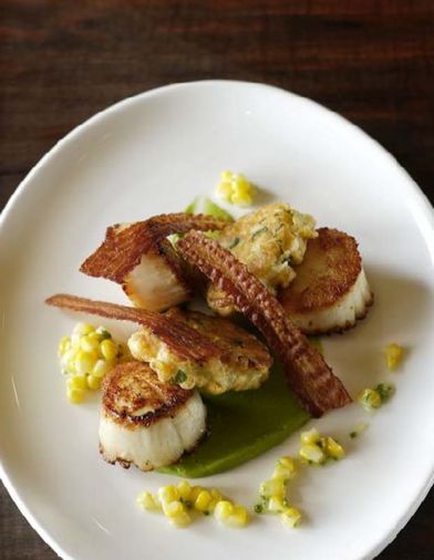 JORY Restaurant’s <a href='jory-sunny-jin-pan-seared-diver-scallops'>Pan Seared Diver Scallops, Corn-lovage Fritters, Bacon Ships and Hass Avocado Coulis</a>. The corn was picked from the chef’s one-acre garden.