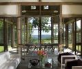 Steel and glass doors open up the barn on three sides to reveal stunning vistas