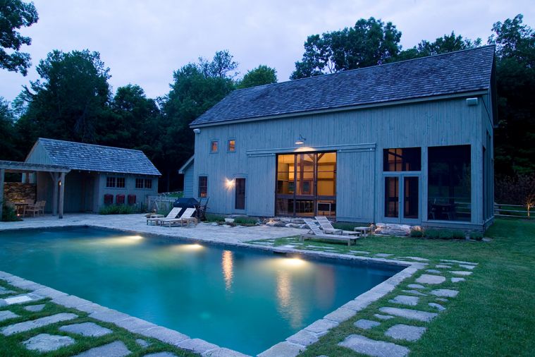 The barn seen from the screened-in porch, and looking toward the traditional barn siding and doors.