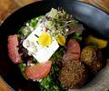 Freekeh Bowl with Chickpea Quinoa Fritters, Citrus, Young Lettuce, Feta, Charred Onion Crema