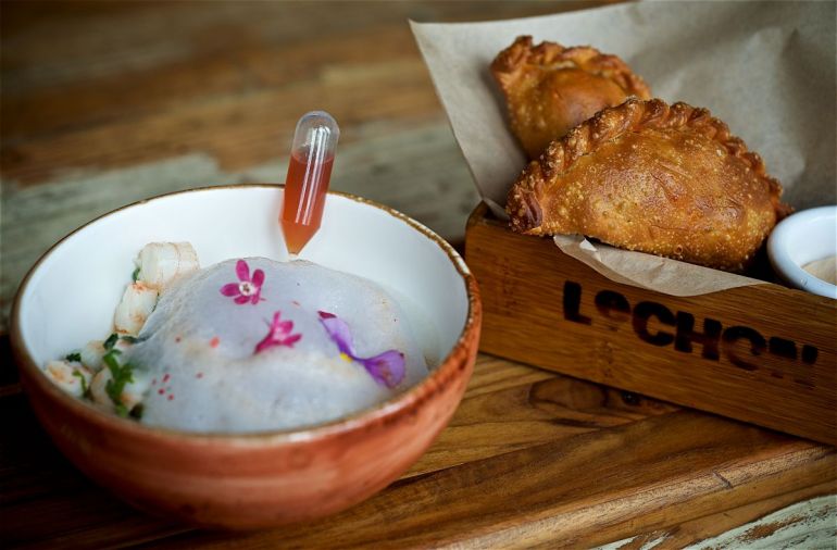 Lechon puts an unexpeted spin on ceviche by topping it with tequila-lime foam and an ampule of ruddy chili syrup for diners to apply as it suits them. Crisp empanadas are stuffed with savory fillings like braised brisket or piquillo peppers.
