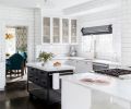 Dark and with limited counter space and storage, the kitchen provided the impetus for the remodel that would eventually touch almost every surface in the house. After painting existing cabinets and woodwork white, new cabinets and an island were added to expand the work areas.