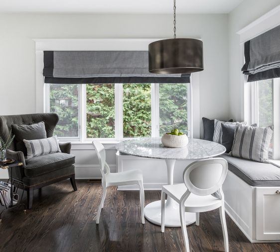 Previously separated from the kitchen, the redone breakfast area now is more integrated with the kitchen both in its color and design schemes and in its revitalized utilitarianism.