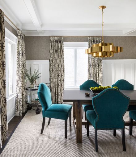 Blues and yellow in the family gathering room and brass and turquoise in the formal dining room give the rooms a lively infusion of color.