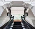 The centerpiece staircase gets a
modern treatment with black-and-white detail and a sisal runner from Contract Furnishings Mart.