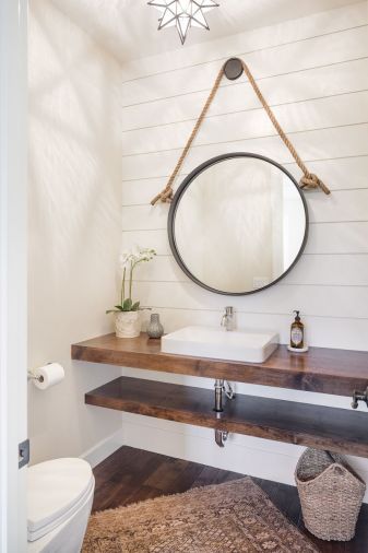 Upstairs, Taryn designed a custom floating vanity for the master bedroom. “When you have a long wall, you don’t want to just plop a regular vanity in it,” says Taryn. Using a floating vanity gives the room a lighter, more spacious feel.