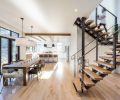 Light pours through the windows of this home, which was specifically sited and designed to capture every bit of that precious Oregon sunlight. Inside, an airy feel is anchored by the judicious use of rustic materials like stone, leather, and knotty oak.