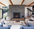 The colossal fireplace pays homage to the central hearths of rural French farmhouses — only with a few major upgrades, like gas flame and a stacked ledgestone that entirely conceals grout lines. “We designed most of the home around that centerpiece,” says Jordan.
