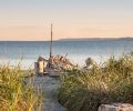 Sea, sand, sun, and salt spray. The perfect qualities for a second site are, paradoxically, also the things that endanger it. 
But on the windswept southern end of Whidbey Island, this family retreat combines nautical themes, industrial design, 
and a casual vibe with some serious durability features to ensure many multigenerational gatherings to come.