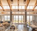 The great room looks out over Useless Bay, with floor-to-ceiling Kolbe windows to let the afternoon light in. Because of the high winds,
John and Steve chose sliding doors, which can’t be blown closed, instead of traditional French doors.