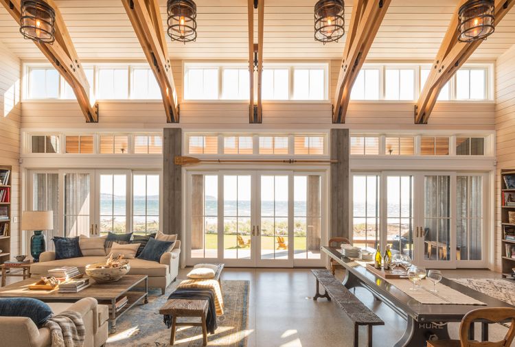 The great room looks out over Useless Bay, with floor-to-ceiling Kolbe windows to let the afternoon light in. Because of the high winds,
John and Steve chose sliding doors, which can’t be blown closed, instead of traditional French doors.