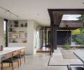 They created a garden shed that served double-duty: providing ample space for garden implement storage, while screening the raised beds on the south side of the home from interior view. 
© Andrew Pogue